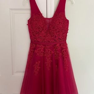 Red semiformal/formal dress with lace appliqués.